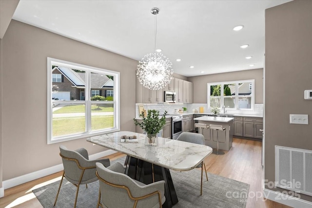 1033 12th Avenue Dr NW, Hickory, NC 28601 - dining room with light wood finished floors, recessed lighting, and a chandelier