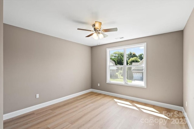 1033 12th Avenue Dr NW, Hickory, NC 28601 - spare room with light wood-style floors and ceiling fan