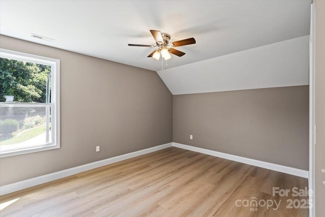 1033 12th Avenue Dr NW, Hickory, NC 28601 - additional living space featuring wood finished floors, ceiling fan, and vaulted ceiling