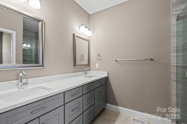 1033 12th Avenue Dr NW, Hickory, NC 28601 - bathroom featuring double vanity, tile patterned floors, and a shower with shower door