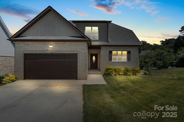 1033 12th Avenue Dr NW, Hickory, NC 28601 - traditional-style home featuring board and batten siding, brick siding, a lawn, driveway, and a garage