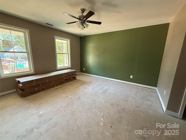 105 Elk Creek Ln, Hudson, NC 28638 - spare room featuring baseboards and a ceiling fan