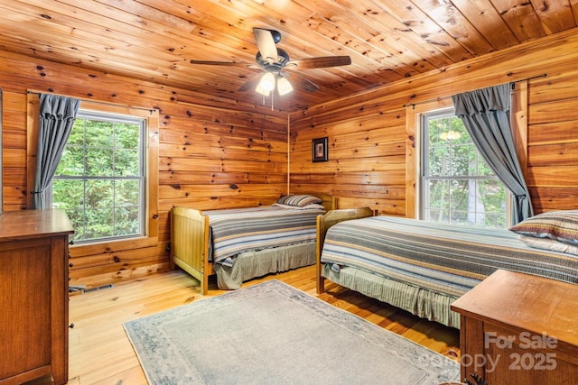 28 Upper Ridge Rd, Black Mountain, NC 28711 - bedroom featuring wood-type flooring, wood walls, and ceiling fan