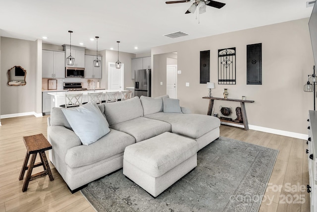 3313 Plum Dr, Monroe, NC 28110 - living room featuring ceiling fan, recessed lighting, and light wood-type flooring