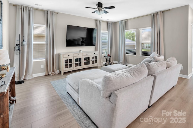 3313 Plum Dr, Monroe, NC 28110 - living room featuring a ceiling fan and light wood-style floors