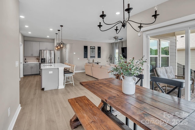 3313 Plum Dr, Monroe, NC 28110 - dining area featuring a chandelier, recessed lighting, light wood-style floors, and a ceiling fan