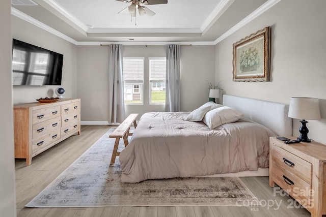 3313 Plum Dr, Monroe, NC 28110 - bedroom with a tray ceiling, light wood-type flooring, crown molding, and a ceiling fan