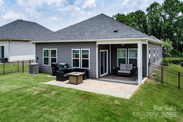 3313 Plum Dr, Monroe, NC 28110 - back of house featuring a fenced backyard, a patio, an outdoor hangout area, and roof with shingles