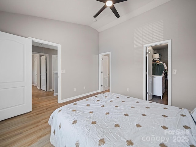 8516 Paw Valley Ln, Charlotte, NC 28214 - bedroom featuring vaulted ceiling, light wood-type flooring, a spacious closet, a ceiling fan, and a closet