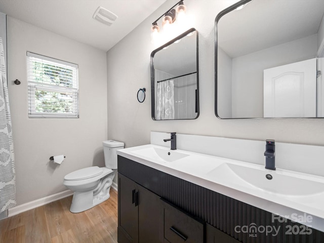 8516 Paw Valley Ln, Charlotte, NC 28214 - full bath with wood finished floors, double vanity, and curtained shower