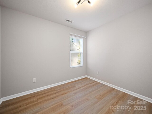 8516 Paw Valley Ln, Charlotte, NC 28214 - empty room with light wood-style flooring and baseboards