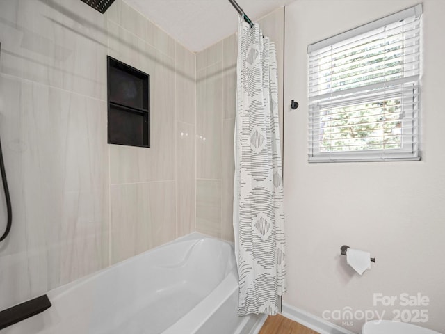 8516 Paw Valley Ln, Charlotte, NC 28214 - bathroom with shower / bathtub combination with curtain and baseboards