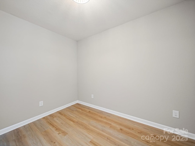 8516 Paw Valley Ln, Charlotte, NC 28214 - spare room featuring baseboards and light wood finished floors