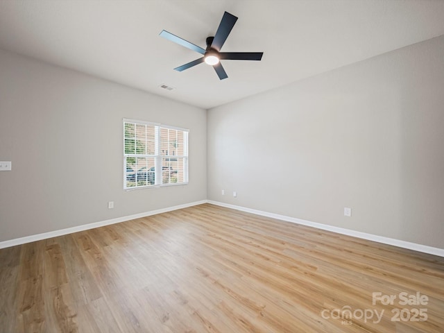 8516 Paw Valley Ln, Charlotte, NC 28214 - empty room featuring light wood-style flooring and a ceiling fan