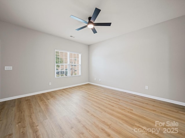 8516 Paw Valley Ln, Charlotte, NC 28214 - unfurnished room with light wood-style flooring and ceiling fan