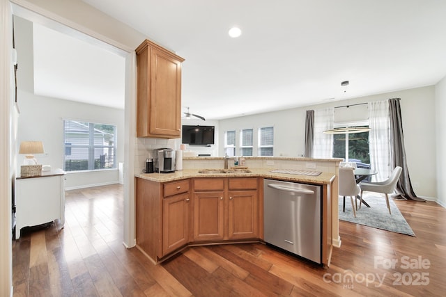 2203 Whitford Ln, Charlotte, NC 28210 - kitchen with stainless steel dishwasher, dark wood-style flooring, a peninsula, recessed lighting, and light stone counters