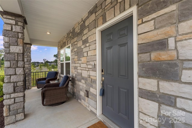 135 Orson Oaks Ln, Pineville, NC 28134 - property entrance with covered porch and stone siding