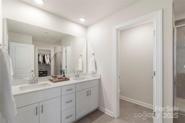 135 Orson Oaks Ln, Pineville, NC 28134 - bathroom with double vanity, a stall shower, tile patterned floors, and recessed lighting