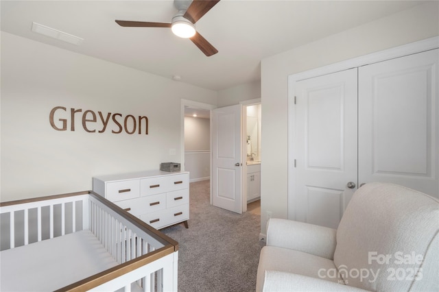 135 Orson Oaks Ln, Pineville, NC 28134 - carpeted bedroom featuring a closet, a crib, and a ceiling fan