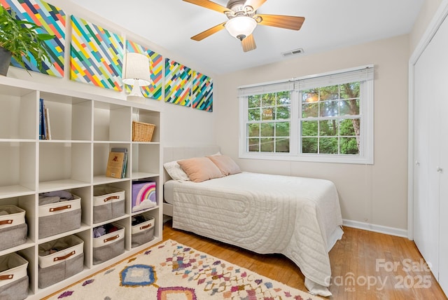 10 Daniel Ln, Black Mountain, NC 28711 - bedroom with wood finished floors, a closet, and a ceiling fan
