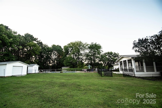 34107 Watson Rd, Albemarle, NC 28001 - view of yard with a detached garage, an outbuilding, and view of scattered trees
