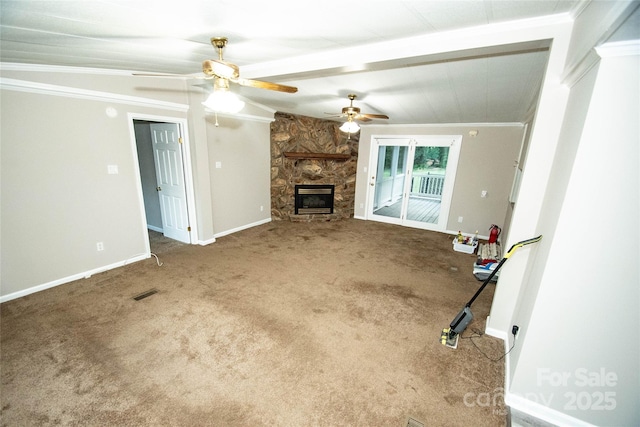 34107 Watson Rd, Albemarle, NC 28001 - unfurnished living room with ornamental molding, carpet floors, a ceiling fan, a stone fireplace, and beamed ceiling