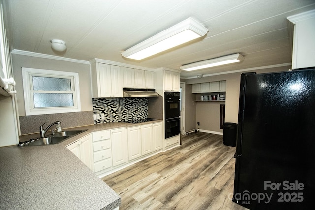 34107 Watson Rd, Albemarle, NC 28001 - kitchen featuring black appliances, crown molding, backsplash, under cabinet range hood, and light wood finished floors