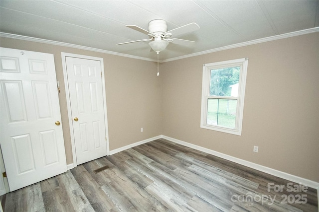 34107 Watson Rd, Albemarle, NC 28001 - unfurnished bedroom with crown molding, wood finished floors, and a ceiling fan