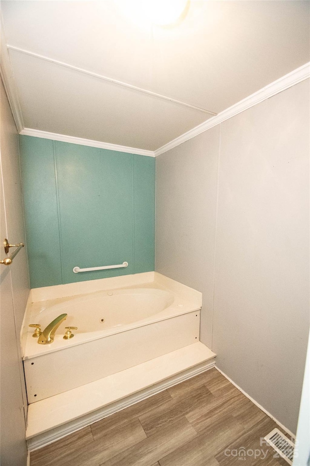 34107 Watson Rd, Albemarle, NC 28001 - full bath with ornamental molding, a jetted tub, and wood finished floors