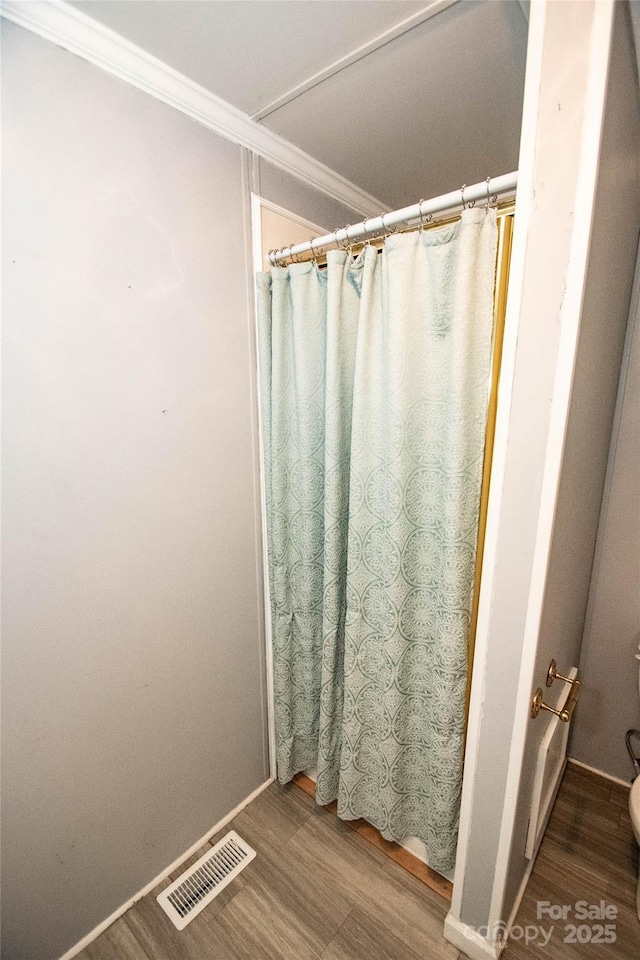 34107 Watson Rd, Albemarle, NC 28001 - bathroom with wood finished floors, crown molding, and curtained shower