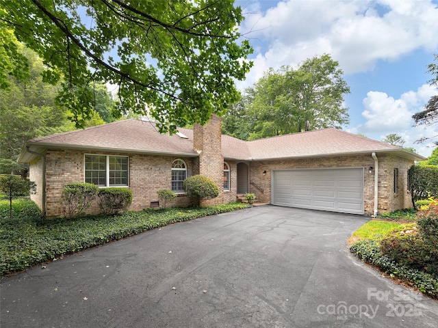 189 Cove Loop Rd, Hendersonville, NC 28739 - single story home featuring driveway, brick siding, a chimney, an attached garage, and roof with shingles