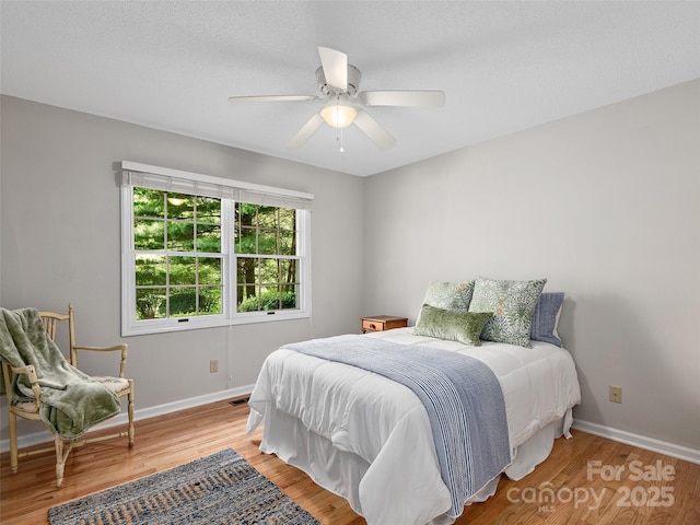 189 Cove Loop Rd, Hendersonville, NC 28739 - bedroom with wood finished floors and a ceiling fan