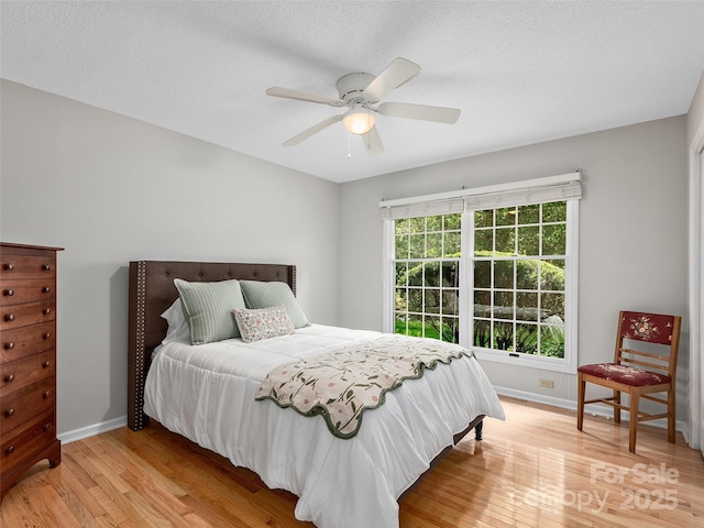 189 Cove Loop Rd, Hendersonville, NC 28739 - bedroom with light wood-style floors and a ceiling fan