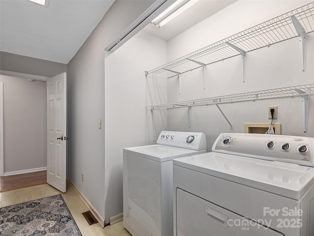 189 Cove Loop Rd, Hendersonville, NC 28739 - washroom featuring washer and dryer and baseboards
