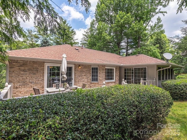 189 Cove Loop Rd, Hendersonville, NC 28739 - rear view of property featuring brick siding and roof with shingles
