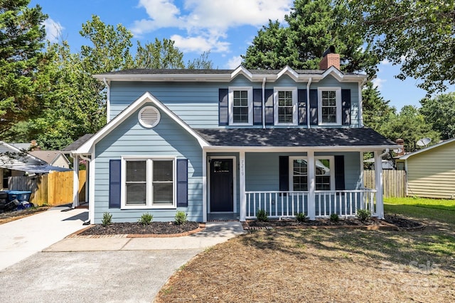 7219 Spring Morning Ln, Charlotte, NC 28227 - view of front of house with a porch, a chimney, and a shingled roof