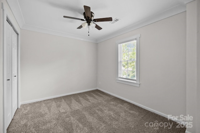 7219 Spring Morning Ln, Charlotte, NC 28227 - unfurnished bedroom featuring carpet, a closet, a ceiling fan, and crown molding