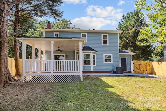 7219 Spring Morning Ln, Charlotte, NC 28227 - back of house featuring ceiling fan, a chimney, a gate, covered porch, and a patio area