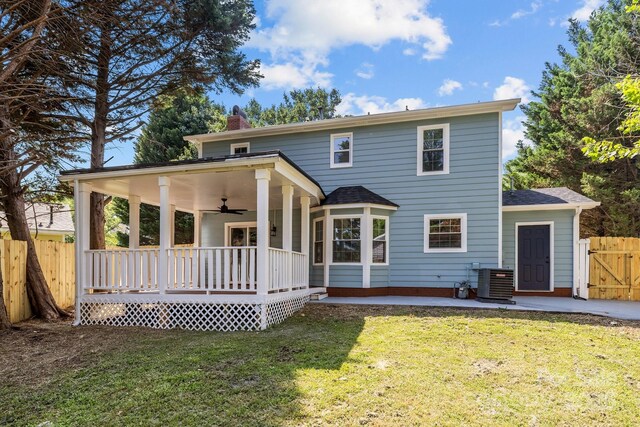 7219 Spring Morning Ln, Charlotte, NC 28227 - back of house featuring ceiling fan, a chimney, a patio, a gate, and a shingled roof
