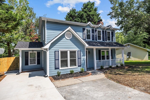 7219 Spring Morning Ln, Charlotte, NC 28227 - traditional-style house featuring a porch and a chimney