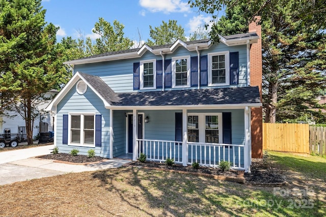 7219 Spring Morning Ln, Charlotte, NC 28227 - traditional-style house with covered porch, a chimney, and a shingled roof