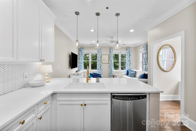106 N Laurel Ave Unit 118, Charlotte, NC 28207 - kitchen featuring stainless steel dishwasher, a peninsula, decorative backsplash, open floor plan, and white cabinets
