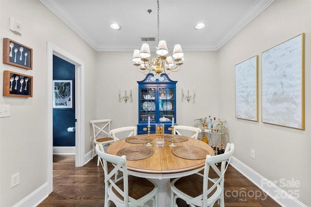 106 N Laurel Ave Unit 118, Charlotte, NC 28207 - dining space featuring a chandelier, crown molding, dark wood-style floors, and recessed lighting