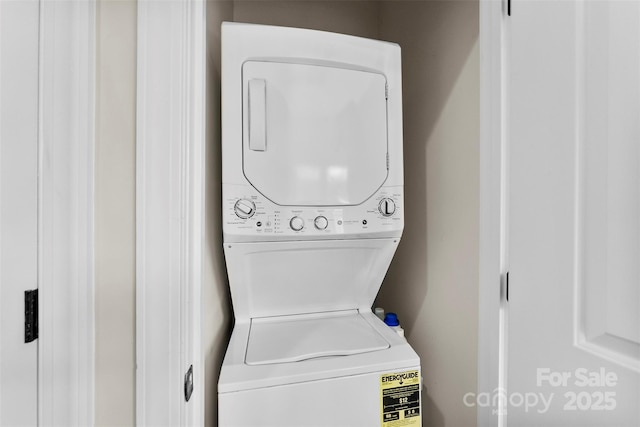 106 N Laurel Ave Unit 118, Charlotte, NC 28207 - laundry room featuring stacked washing machine and dryer