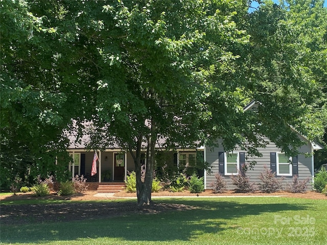 3210 Crow Row, Monroe, NC 28112 - view of property hidden behind natural elements featuring a front yard
