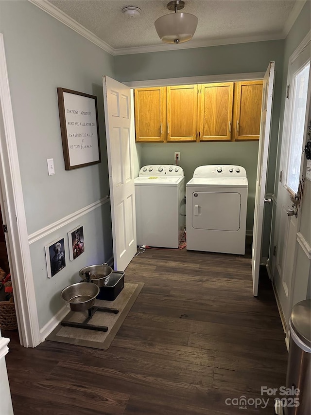 3210 Crow Row, Monroe, NC 28112 - laundry room with cabinet space, separate washer and dryer, ornamental molding, dark wood-type flooring, and a textured ceiling
