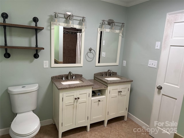 3210 Crow Row, Monroe, NC 28112 - bathroom with two vanities, tile patterned floors, a shower with curtain, and crown molding