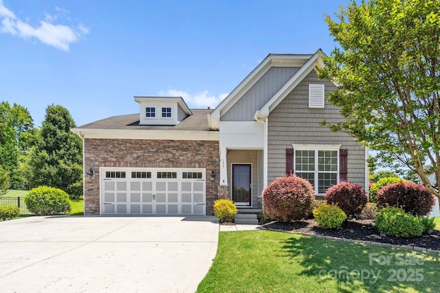 159 E Warfield Dr, Mooresville, NC 28115 - view of front of home featuring driveway, a garage, stone siding, and board and batten siding