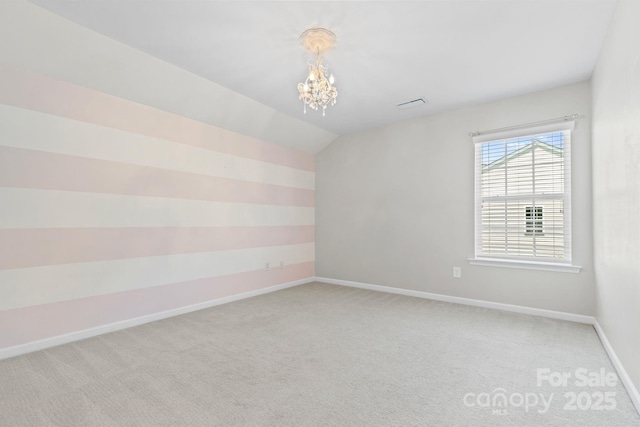 159 E Warfield Dr, Mooresville, NC 28115 - spare room featuring a chandelier, light colored carpet, and lofted ceiling
