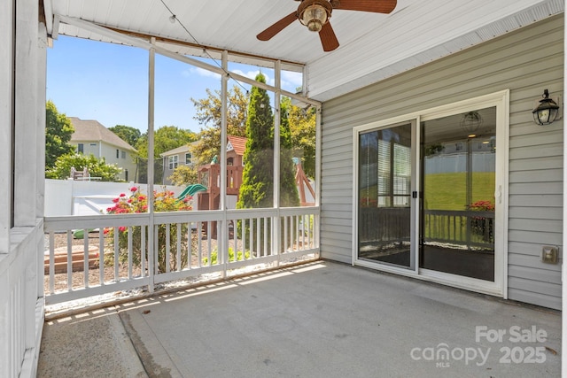 159 E Warfield Dr, Mooresville, NC 28115 - unfurnished sunroom featuring a ceiling fan and a residential view